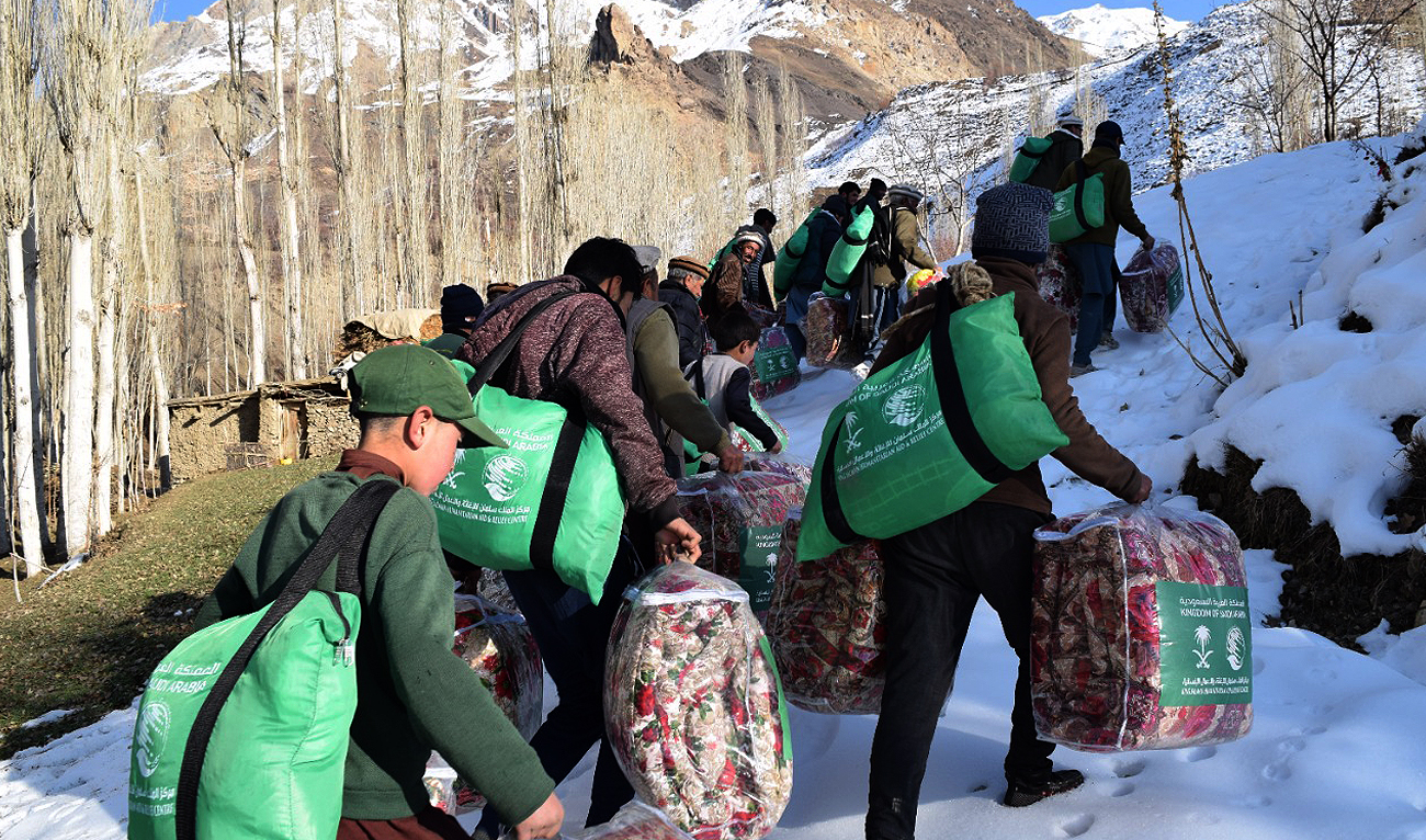 In this handout picture released by King Salman Humanitarian Aid and Relief (KSrelief) on December 14, 2022 shows teams distributing winter relief packages in northern Pakistan. (Photo courtesy: KSrelief)