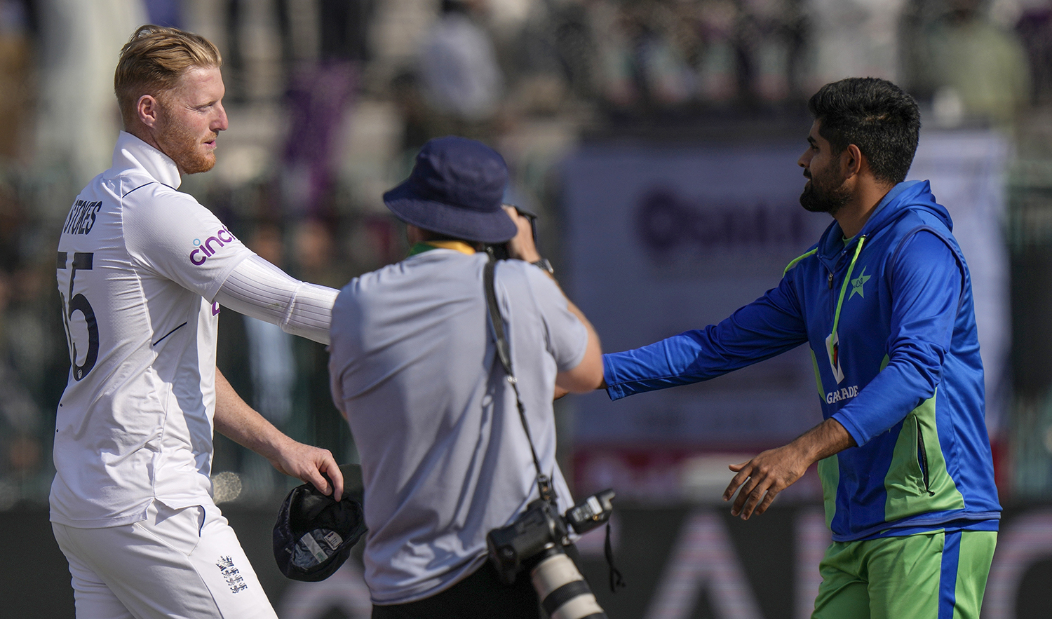 England's skipper Ben Stokes, left, shakes hand with his Pakistani counterpart Babar Azam after winning the second test cricket match against Pakistan, in Multan, Pakistan, on December 12, 2022. (AP)