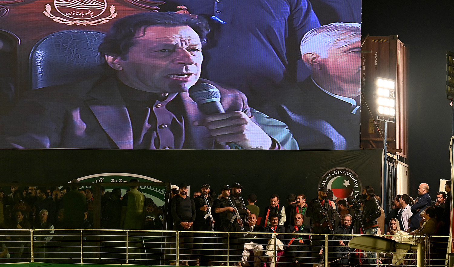 Former Pakistan Prime Minister Imran Khan appears on a giant screen as he addresses an anti-government rally in Rawalpindi on November 26, 2022. (AFP/File)