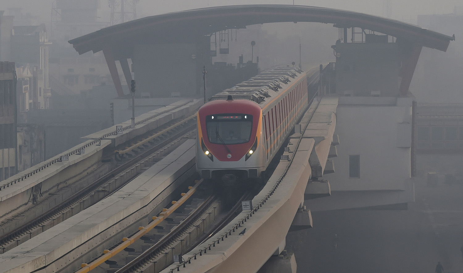 Orange Line Metro Train (OLMT) makes way amid smoggy conditions in Lahore, Pakistan on November 27, 2021. (AFP/File)