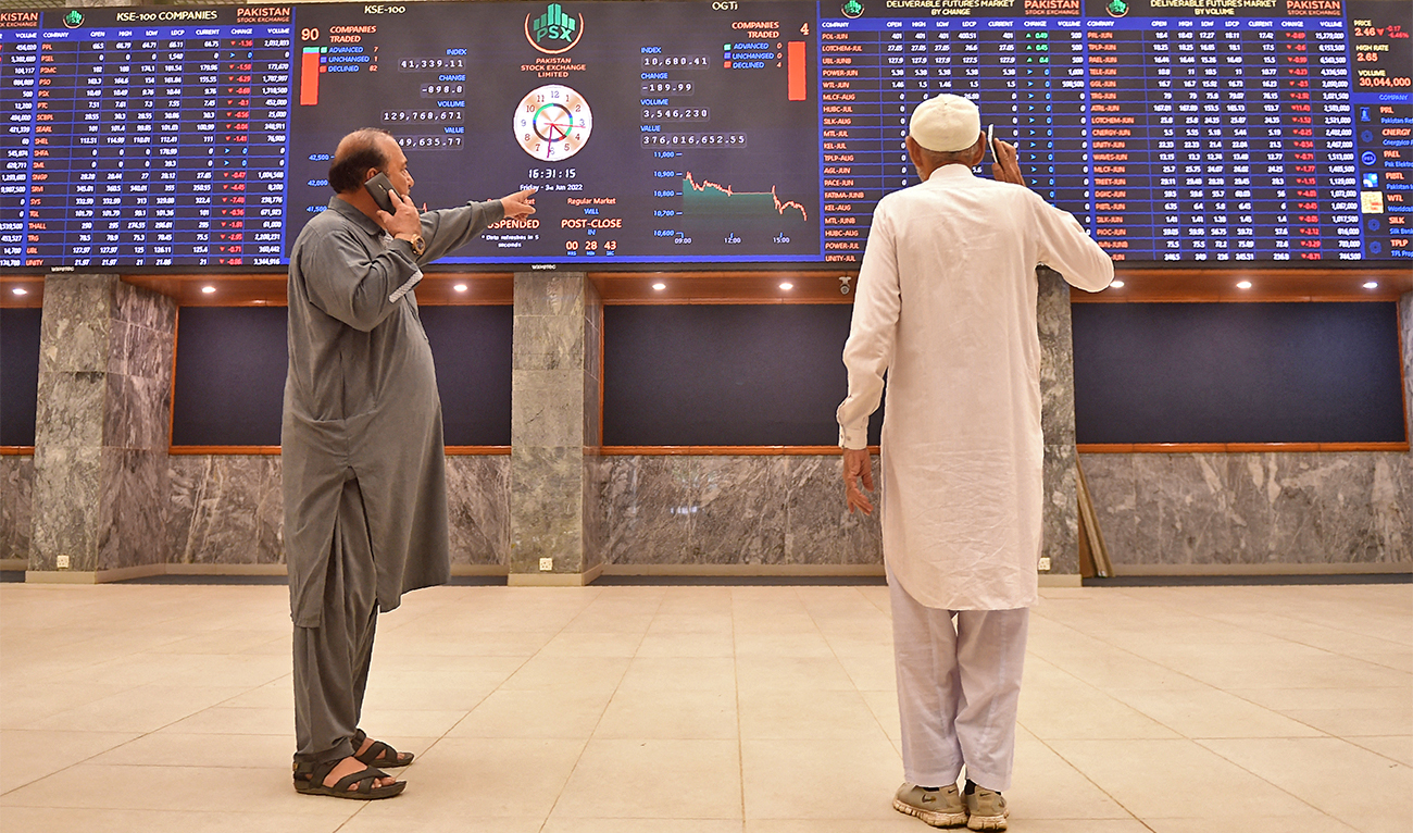 Stockbrokers monitor the share prices during a trading session at the Pakistan Stock Exchange (PSX) in Karachi, Pakistan, on June 3, 2022. (AFP/File)