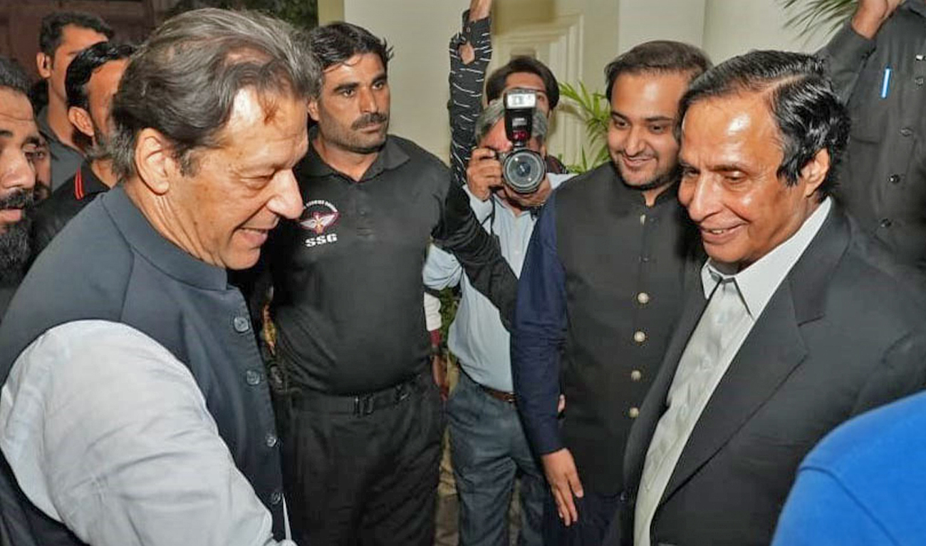 In this file picture, posted on October 26, 2022, shows Pakistan's former Prime Minister Imran Khan (left) greeting Chief Minister of Punjab Parvez Elahi (right). (Photo courtesy: Chaudhry Parvez Elahi/Facebook)