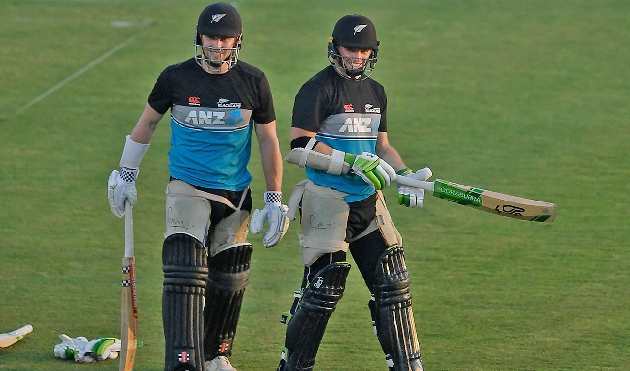 New Zealand's captain Tom Latham (R) and teammate Henry Nicholls arrive to bat during a practice session at the Rawalpindi Cricket Stadium in Rawalpindi on September 16, 2021, a day before their first one-day international (ODI) cricket match between Pakistan and New Zealand. (AFP)