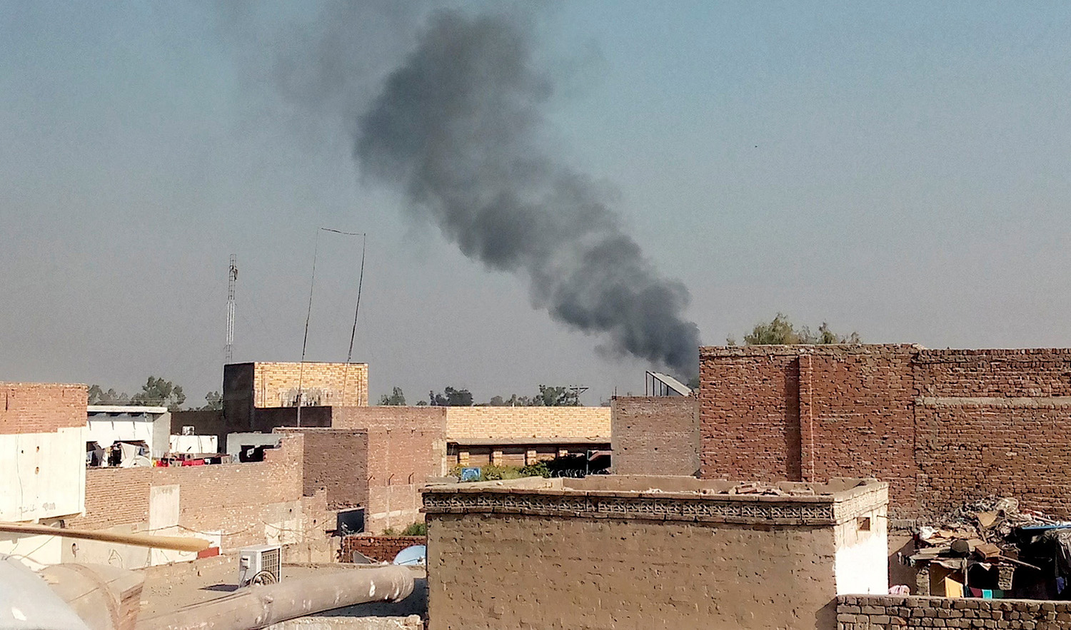 Smoke rises from the cantonment area in Bannu, Pakistan on December 20, 2022. (REUTERS)