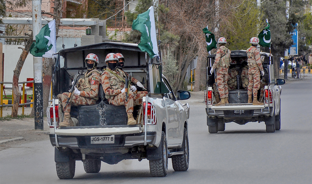 Security personnel patrol with vehicles in Quetta, Pakistan on March 25, 2020. (AFP/File)