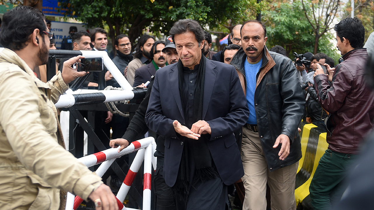 In this file photo taken on January 4, 2017, Pakistan's for prime minister Imran Khan (C) walks with officials as he leaves The Supreme Court in Islamabad. (Photo courtesy: AFP/File)