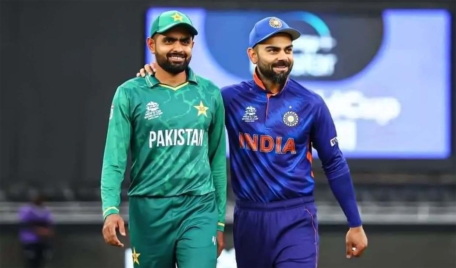 Pakistan's captain Babar Azam, left, and India's Virat Kohli take a walk on the pitch before the start of the ICC mens T20 World Cup cricket match at the Dubai International Cricket Stadium on October 24, 2021. (Photo courtesy: ICC/File)