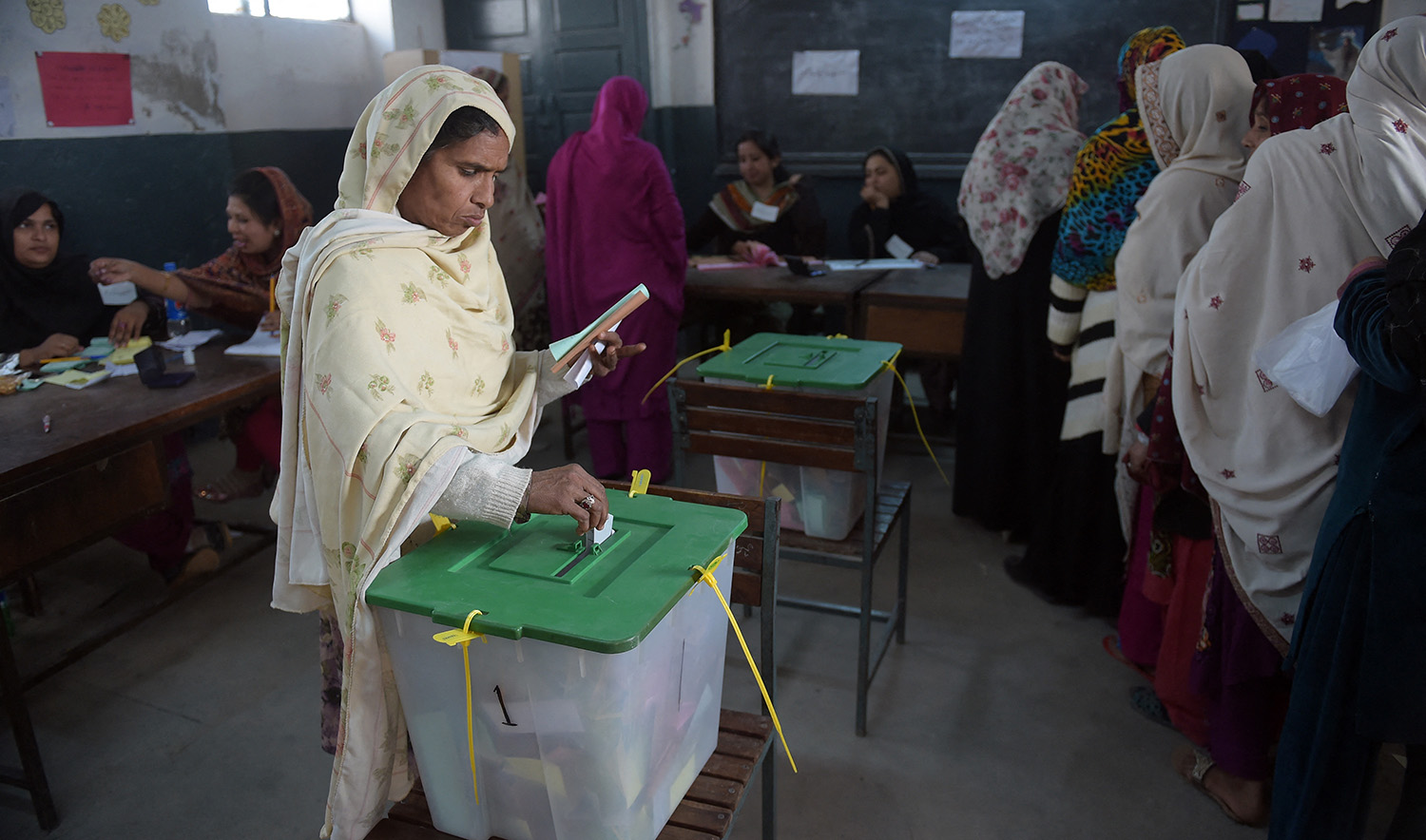 A Pakistani voter casts her ballot at a polling station in Islamabad on November 30, 2015. (AFP/File)