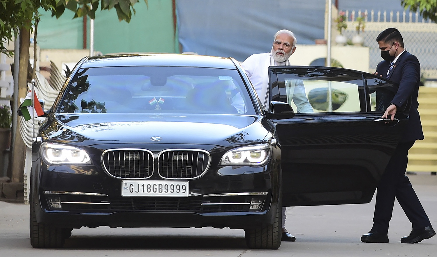 India's Prime Minister, Narendra Modi (2R) leaves after meeting his family members following the funeral rites of his mother in Gandhinagar on December 30, 2022. (AFP)