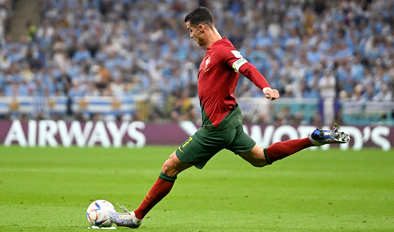 In this file photo taken on November 28, 2022, Portugal's forward #07 Cristiano Ronaldo takes a free kick during the Qatar 2022 World Cup Group H football match between Portugal and Uruguay at the Lusail Stadium in Lusail, north of Doha. (Photo courtesy: AFP)