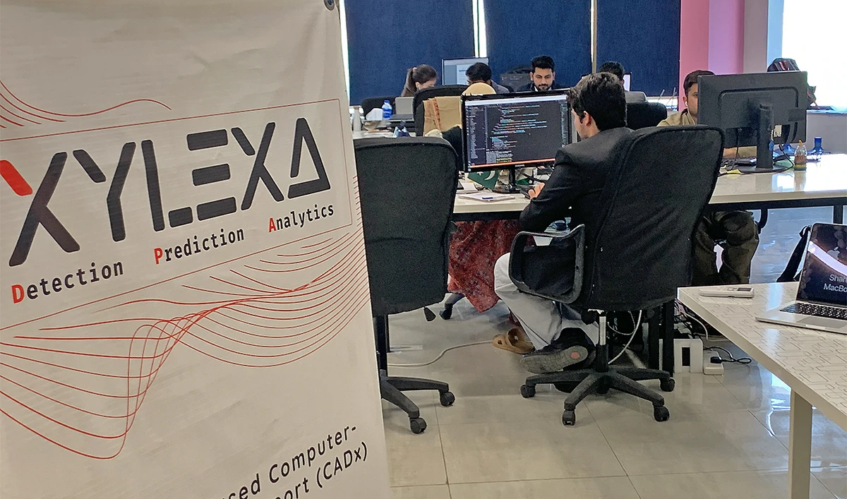 The image shows people working at Pakistani startup Xylexa office in Islamabad, Pakistan, on November 29, 2022. (AN Photo)