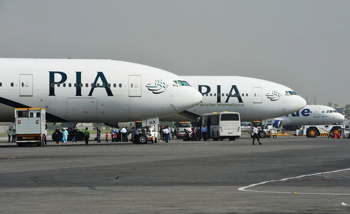 Pakistan International Airline (PIA) planes are positioned on the tarmac at the Benazir Bhutto International Airport in Islamabad on October 10, 2012. (AFP/File)