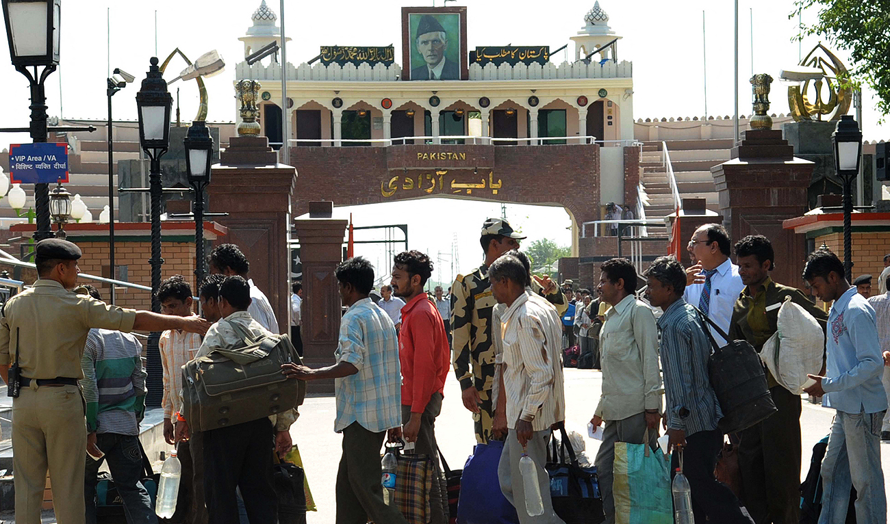 In this file photo taken on May 26, 2014, released Indian prisoners cross the India-Pakistan Wagah border post. (Photo courtesy: AFP/File)