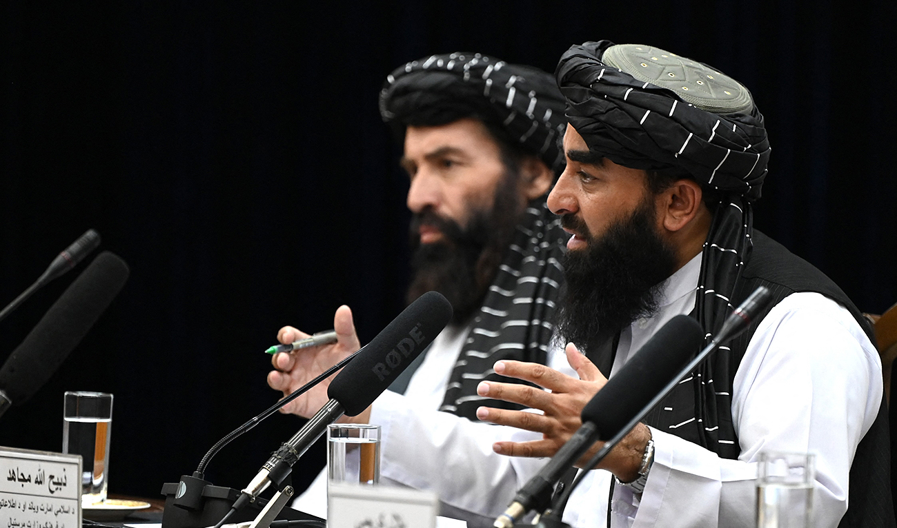 Taliban spokesman Zabihullah Mujahid (R) speaks during a press conference in Kabul on June 30, 2022. (Photo courtesy: AFP/File)