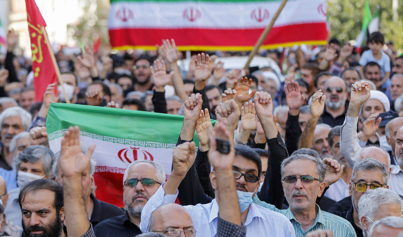 Iranians take part in a pro-government rally in Tajrish square north of Tehran, on October 5, 2022, condemning recent anti-government protests over the death of Mahsa Amini. (Photo courtesy: AFP/File)