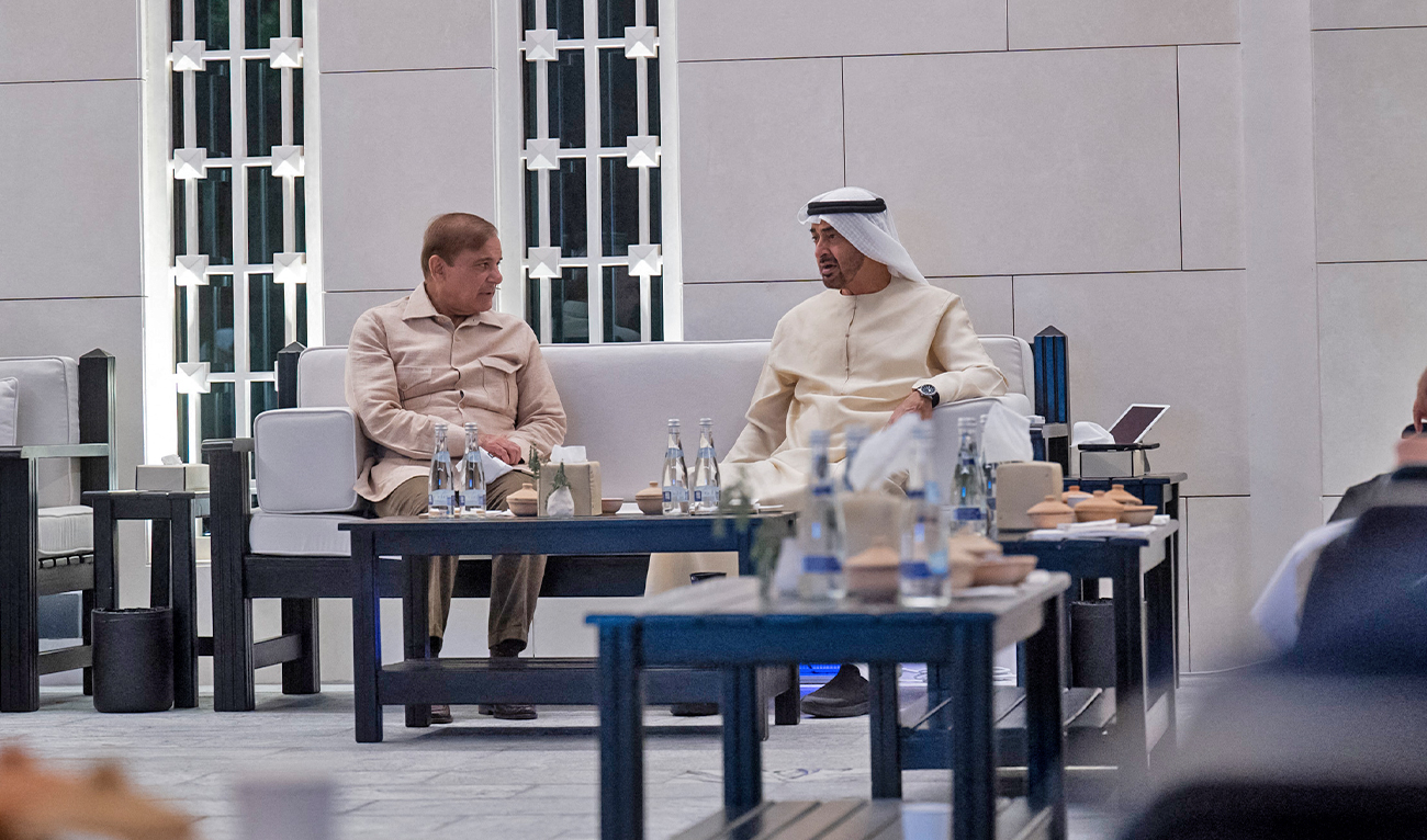 A handout picture released by UAE's Ministry of Presidential Affairs on April 30, 2022, shows UAE President Mohamed bin Zayed Al Nahyan (R) meeting with Pakistan Prime Minister Shahbaz Sharif in the Gulf emirate. (AFP/File)
