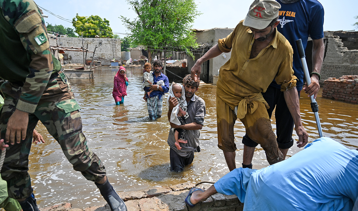 Pakistan's Naval personnel rescue flood-affected people from their damaged houses after heavy monsoon rains in Dadu district, Sindh province on September 7, 2022. (AFP/File)