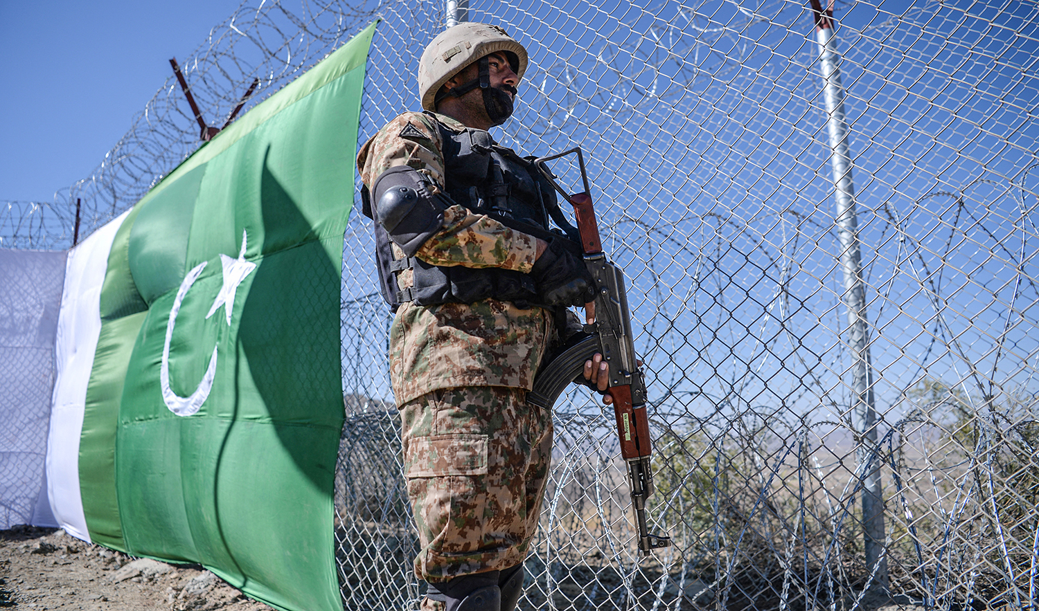 A Pakistani soldier keeps vigil next to a border fencing along with Afghan's Paktika province border in Pakistan's South Waziristan district on October 18, 2017. (AFP/File)