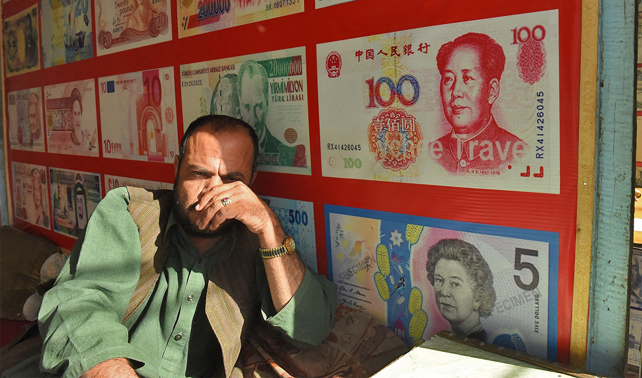 A Pakistani currency dealer waits for the customer in Quetta on January 3, 2018. (AFP/File)