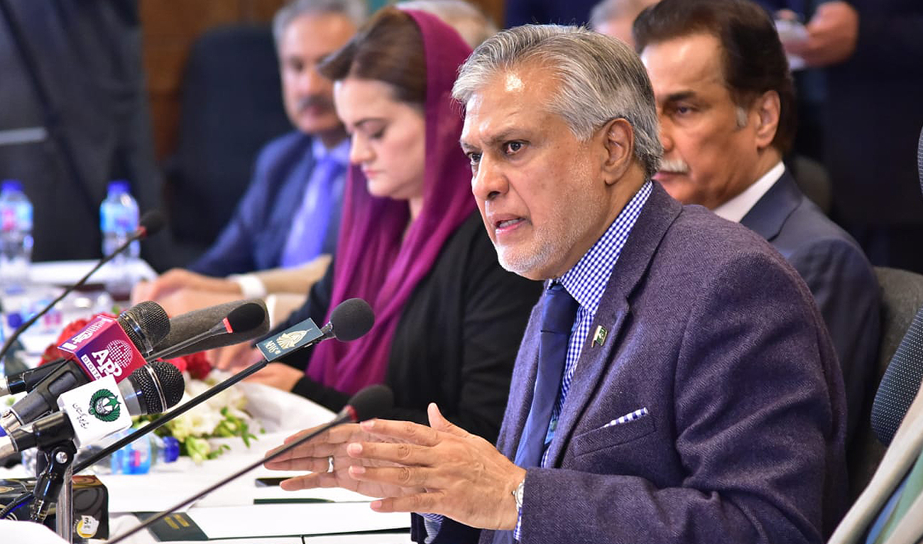 Pakistan finance minister Ishaq Dar gestures during a press briefing in Islamabad on January 4, 2023. (Photo courtesy: Twitter/FinMinistryPak)