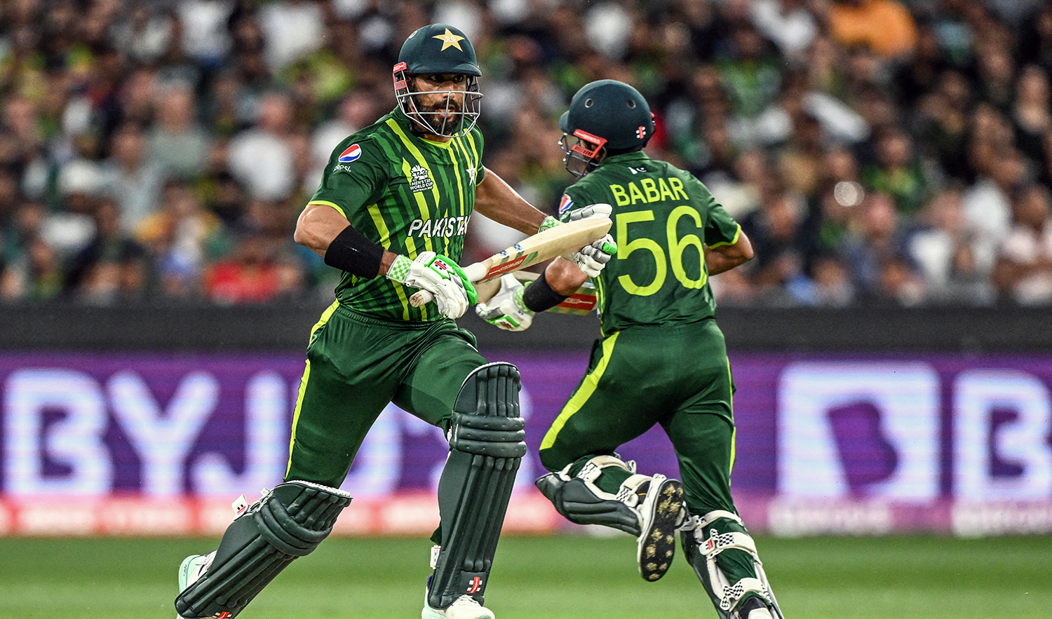 Pakistan's Shan Masood (L) runs between the wickets with Pakistan's Captain Babar Azam during the ICC men's Twenty20 World Cup 2022 final cricket match against England at The Melbourne Cricket Ground (MCG) in Melbourne on November 13, 2022. (AFP/File)