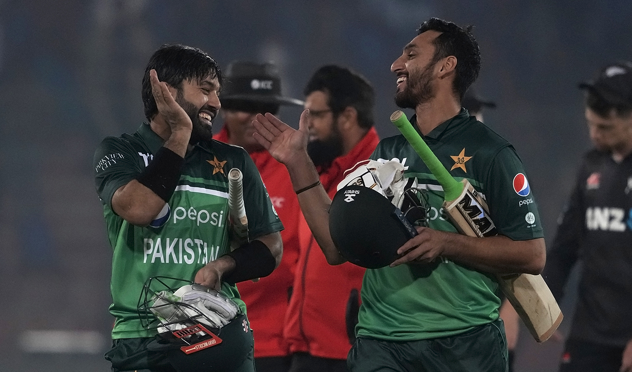 Pakistan's Mohammad Rizwan (left) celebrates with Agha Salman (right) after winning the first one-day international cricket match between Pakistan and New Zealand, in Karachi on Jan. 9, 2023. (Photo courtesy: AP)