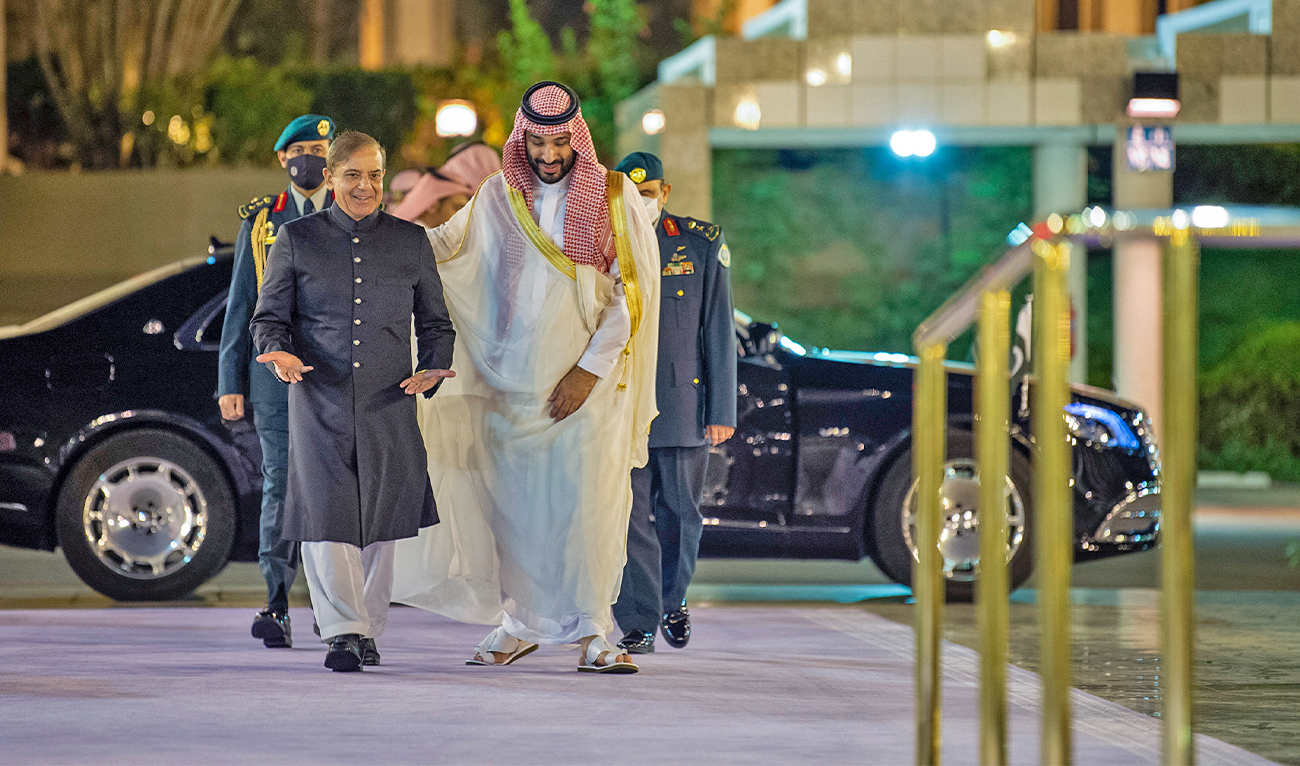 A handout picture provided by the Saudi Royal Palace shows Saudi Arabia's Crown Prince Mohammed Bin Salman (R) welcoming Pakistani Prime Minister Shehbaz Sharif in Jeddah on April 30, 2022. (AFP/File)