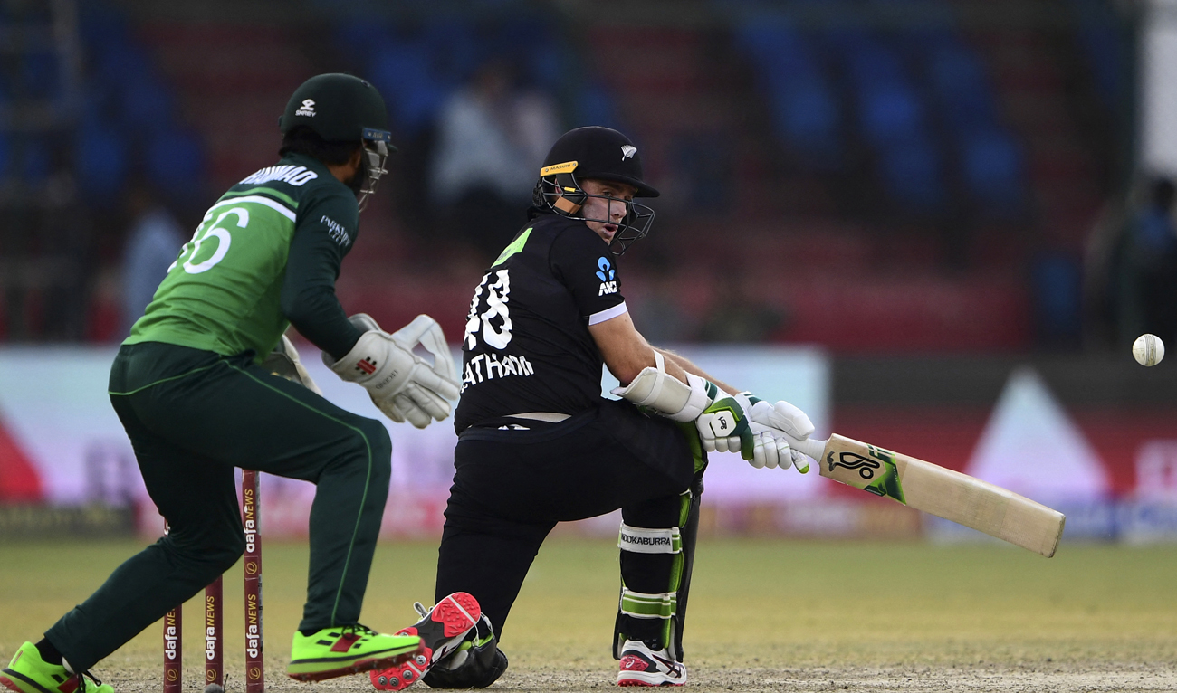 New Zealand's Tom Latham (R) plays a shot during the second one-day international (ODI) cricket match between Pakistan and New Zealand at the National Stadium in Karachi on January 11, 2023. (Photo courtesy: AFP)