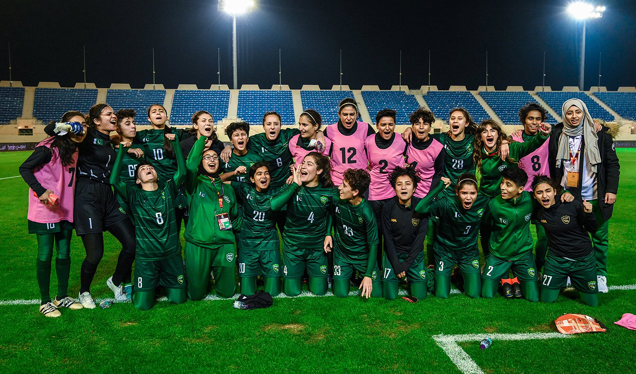 Pakistan women's football team gestures for a group photo after winning the friendly match against Comoros at the Prince Saud bin Jalawi Stadium in Al-Khobar on January 11, 2023. (Photo courtesy: Twitter/TheRealPFF)
