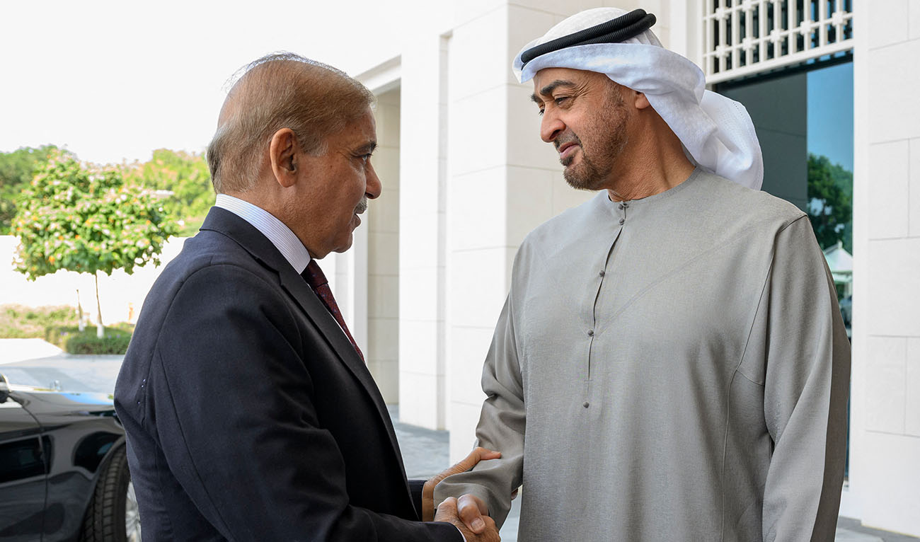 UAE President Sheikh Mohamed bin Zayed al-Nahyan (R) welcomes Shehbaz Sharif, Prime Minister of Pakistan (L), prior to their meeting, at Al Shati Palace in Abu Dhabi on January 12, 2023. (AFP PHOTO / UAE PRESIDENTIAL COURT)