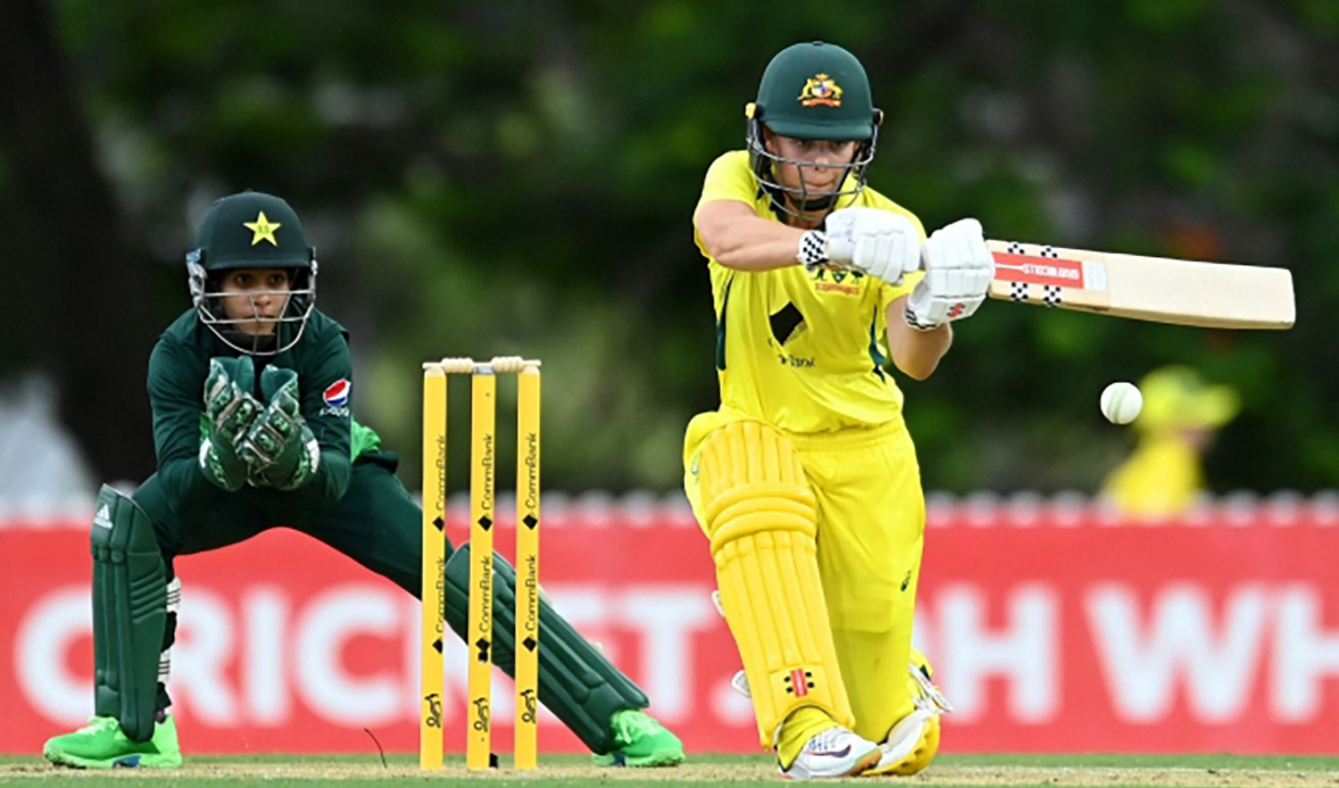 Australia women's cricket team batter plays a shot while Pakistan's wicket-keeper Sidra Nawaz looks on during an ODI match in Brisbane, Australia on January 16, 2023. (Photo courtesy: Pakistan Cricket Board)