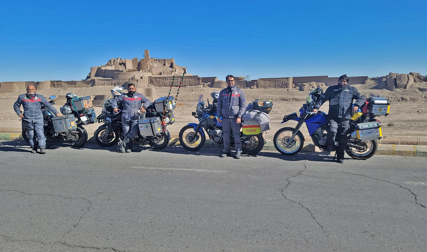Pakistani bikers travellng to Makkah to perform Umrah pose for a picture in Iran's Bam city on January 13, 2023. (Photo courtesy: Mukaram Tareen)
