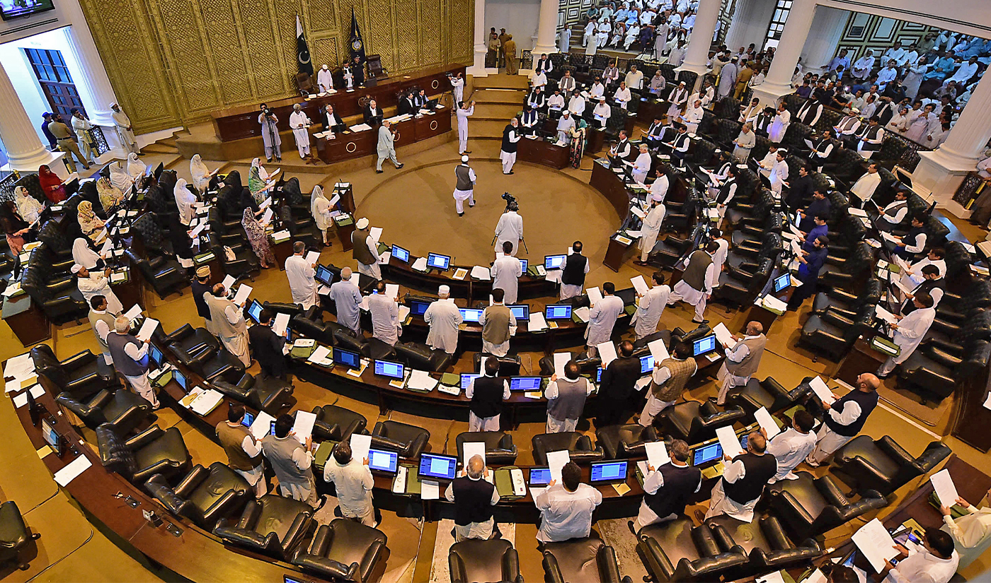 This photograph taken on August 13, 2018 shows Pakistani legislators taking oath during the first session of the provincial assembly after the July 25 general election, in Peshawar. (Photo courtesy: AFP/File)