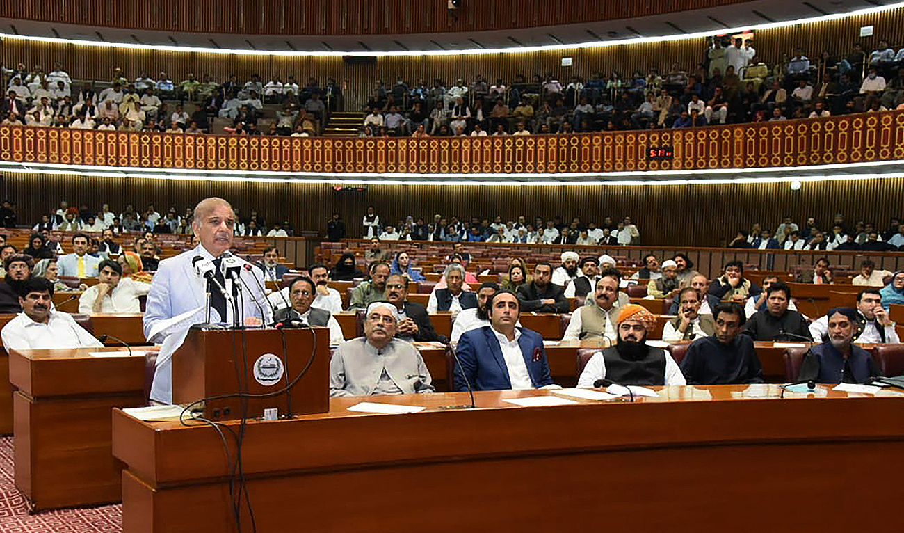 This handout photograph released by the Press Information Department (PID) on April 11, 2022 shows Pakistan Prime Minister Shehbaz Sharif (L) addressing the National Assembly in Islamabad. (Photo courtesy: PID/File)