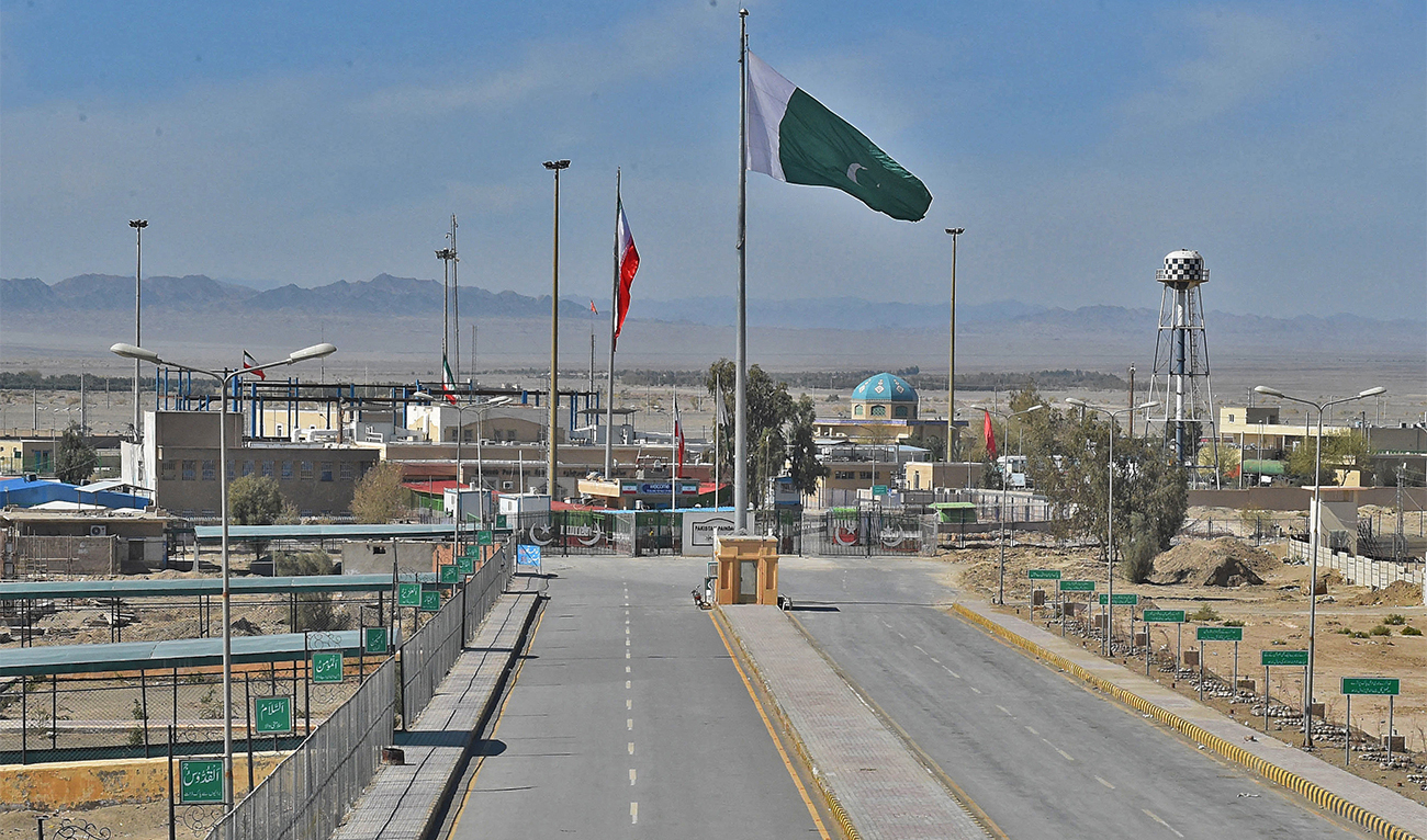 Pakistani and Iranian flags flutter on the closed Pakistan-Iran border in Taftan on February 25, 2020. (AFP/File)