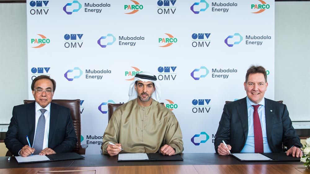 Managing Director PARCO Shahid Mahmood Khan, left, CEO Mubadala Energy Mansoor Mohamed Al Hamed, center, and member of the OMV Executive Board and Executive Officer Fuels & Feedstock Martin van Koten are seen during MoU signing ceremony on January 19, 2022. (Supplied)