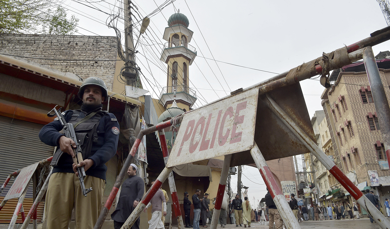Policeman stand guard a day after a suicide attack in Peshawar, Pakistan, on March 5, 2022. (AFP/File)