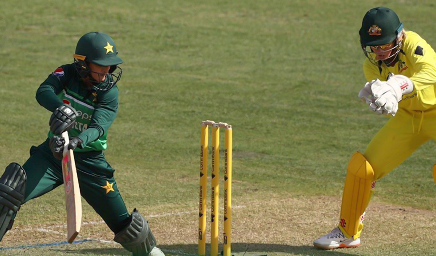 A Pakistani batter and an Australian wicketkeeper watch as the former cuts the ball during the third ODI between Pakistan and Australia on January 21, 2023, in Sydney. (Photo courtesy: @TheRealPCB/Twitter)