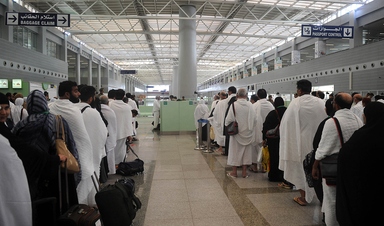 In this file photo taken on July 24, 2017, Pakistani Muslims wait to pass security as they arrive in Jeddah. (Photo courtesy: AFP/File)