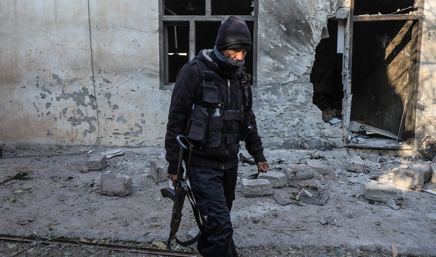 A police officer walks amid the rubble, a day after a suicide attack on a police post in Peshawar, Pakistan on January 20, 2023. (REUTERS)