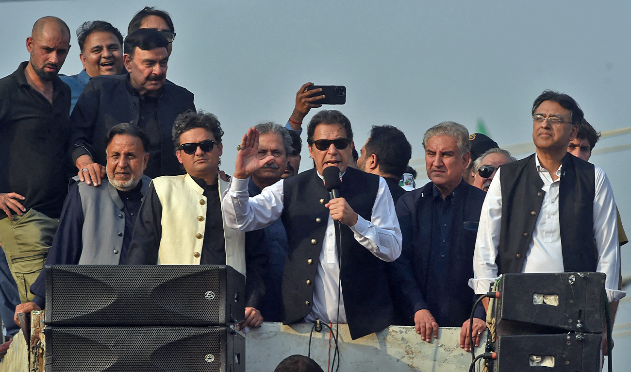 Former Pakistan prime minister Imran Khan (C) addresses his supporters during an anti-government long march towards Islamabad in Lahore, Pakistan, on October 28, 2022. (AFP/File)