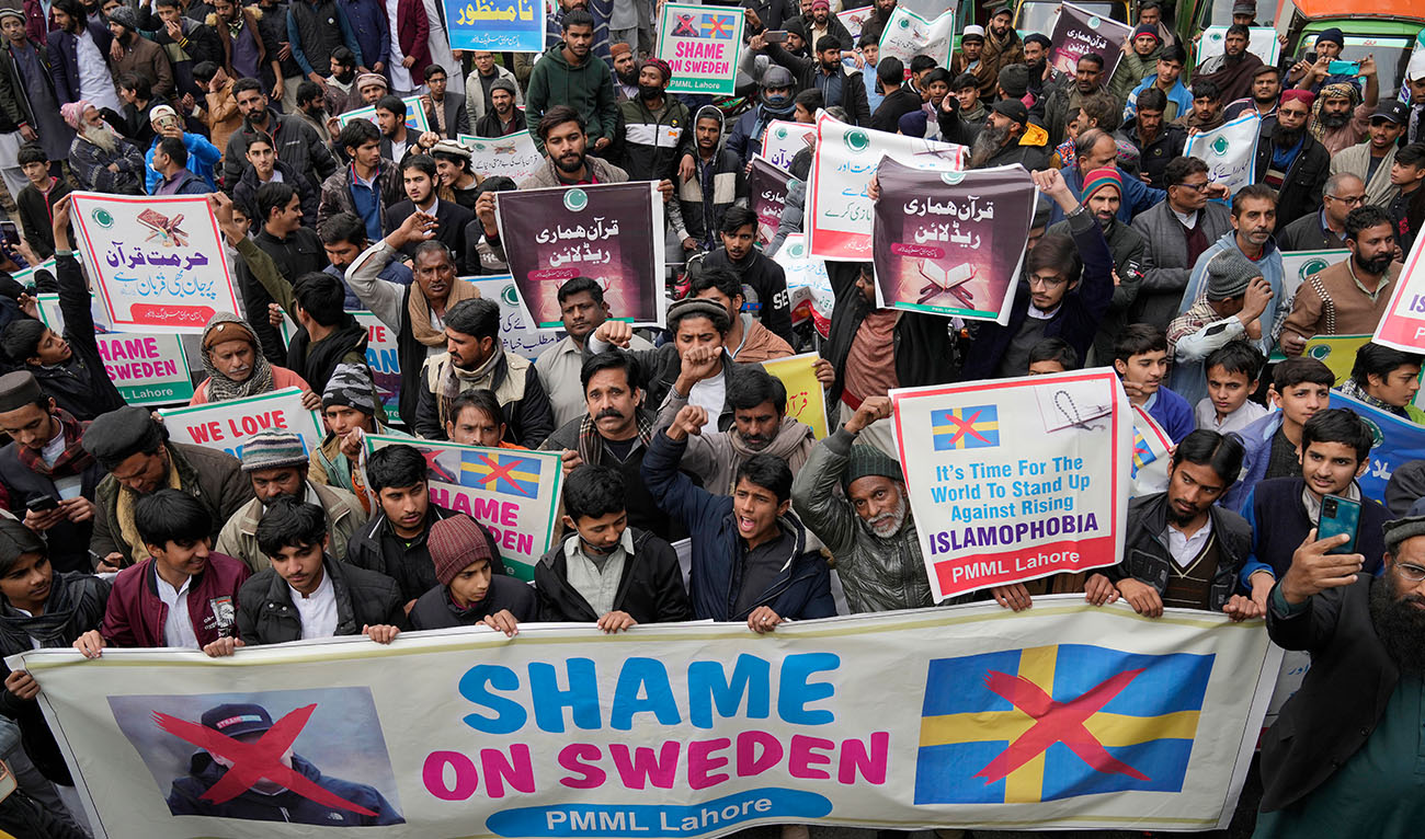 Supporters of Pakistan Markazi Muslim League party chant slogans during a rally against the desecration of Quran, a Muslim holy book, by a Danish anti-islam activist, in Lahore, Pakistan, Tuesday, Jan. 24, 2023. (Photo courtesy: AP)