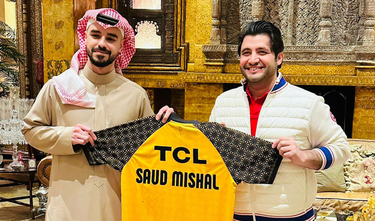 Photo issued on January 26, 2023, shows Javed Afridi (R), the owner of Pakistan Super League (PSL) franchise Peshawar Zalmi presents Peshawar Zalmi shirt to Saudi Cricket Federation Chairman Prince Saud bin Mishal in Riyadh, Saudi Arabia. (Photo courtesy: @JAfridi10/Twitter)
