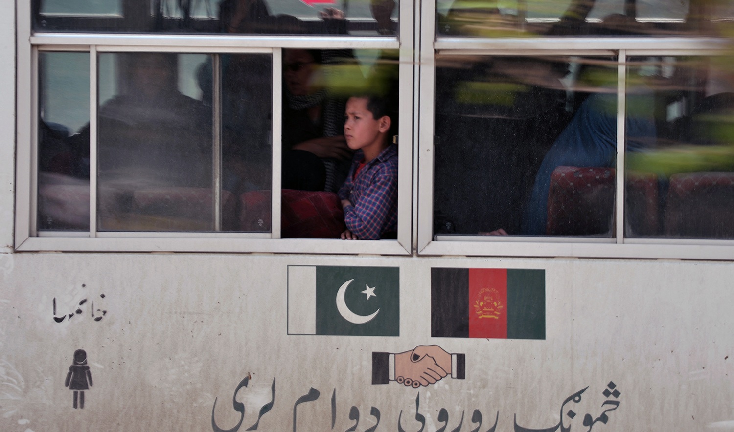 An Afghan boy looks out of a window on a bus in Kabul, Afghanistan, on April 25, 2013. (AFP/File)