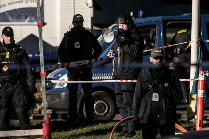 Danish police surround Rasmus Paludan ahead of his burning of a copy of the Qur’an in Copenhagen, Jan. 27, 2023. (Photo courtesy: Reuters)