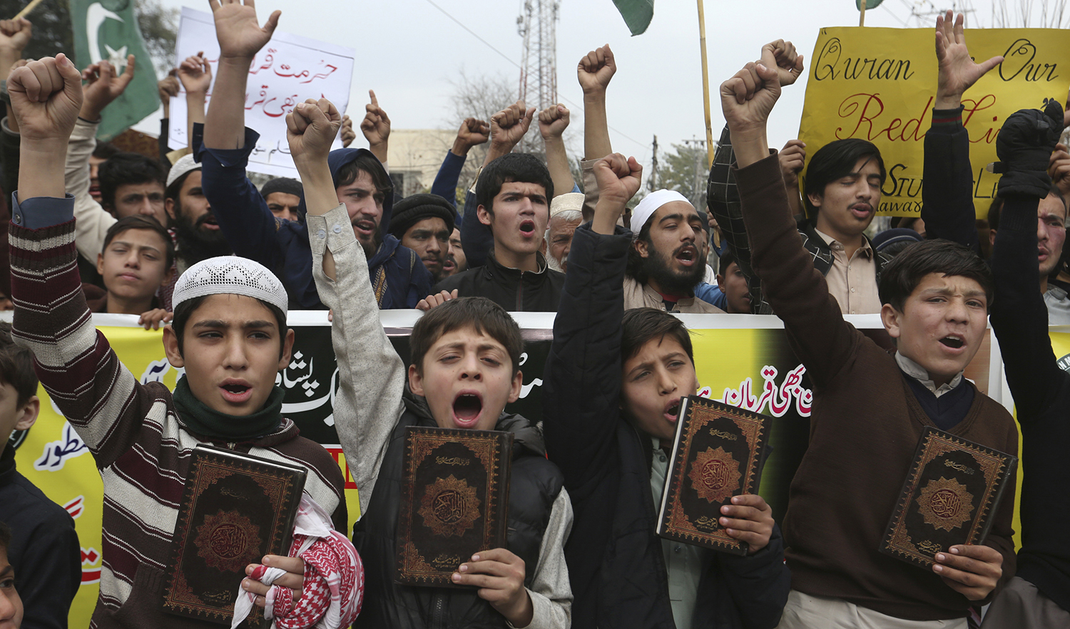Students chant slogans during a protest to denounce the recent desecration of the Holy Quran by a far-right activist in Sweden, in Peshawar, Pakistan, on January 29, 2023. (AP)