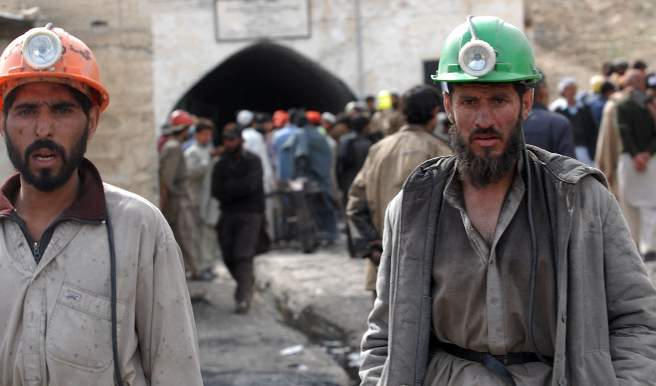 This picture taken on January 30, 2023 shows resident SalCoal miners leave after being brought to the surface during the rescue operation at a coal mine outside Quetta on March 5, 2009. (AFP)