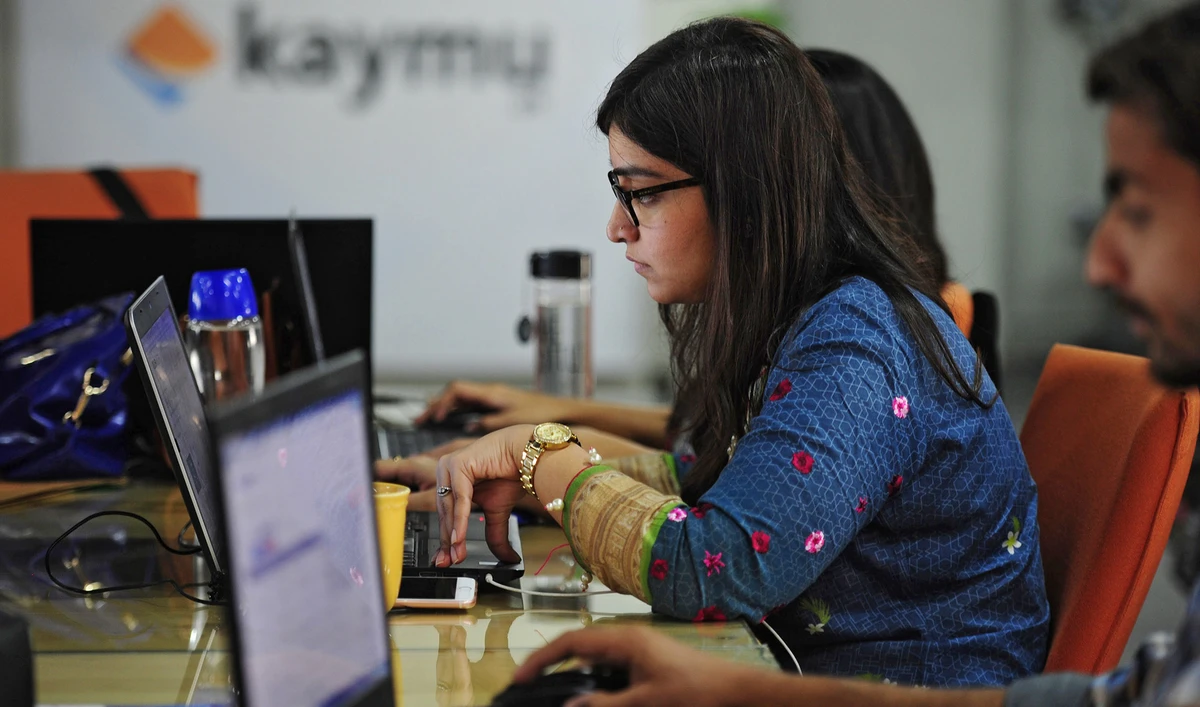 Pakistani employees of online marketplace company Kaymu at work in Karachi on November 19, 2015. (AFP/File)