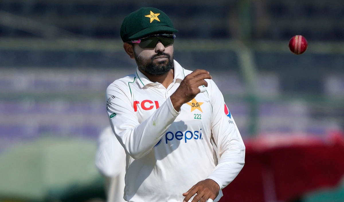 Pakistan's Babar Azam throws the ball during the fourth day of the second test cricket match between Pakistan and New Zealand, in Karachi, Pakistan, on January 5, 2023. (AP)