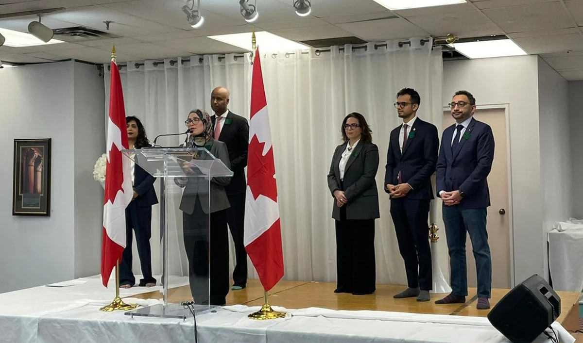 Journalist and activist, Amira Elghawaby (second left) delivers a speech after being appointed as Canada's special representative on combatting Islamophobia in Ottawa, Canada, on January 26, 2023. (Photo courtesy: @OmarAlghabra/Twitter)